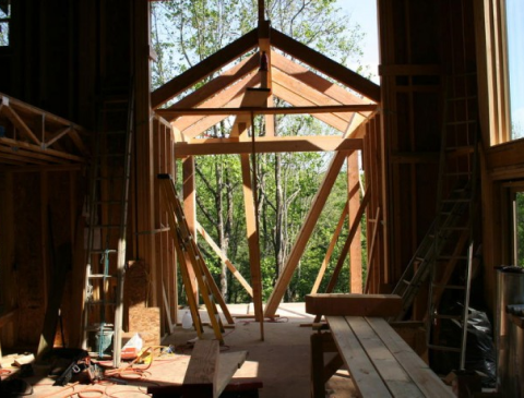 Local Contractors Building Wooden Framework for New Structure