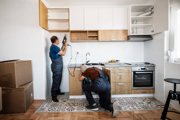 Kitchen remodel contractors installing cabinets and appliances
