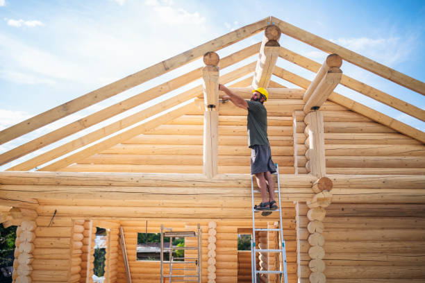 Roof rafter installation in progress at log home construction site